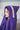 Child wearing jumbo purple hooded towel with Owls trim