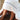 Child sat on floor looking at their feet wearing a elephants hooded towel