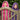 Two little girls, one wearing a pink hooded towel and one a purple hooded towel peeking over a garden gate