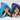 Two children laying on their fronts smiling whilst wearing hooded towels, one in a turquoise hooded towel with Blue Stars trim, one in a navy hooded towel with Green Stars trim