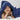 Boy laid on his tummy with a hooded towel draped over him