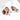 Two sisters laying next to each other wearing matching white hooded towels with a star trim