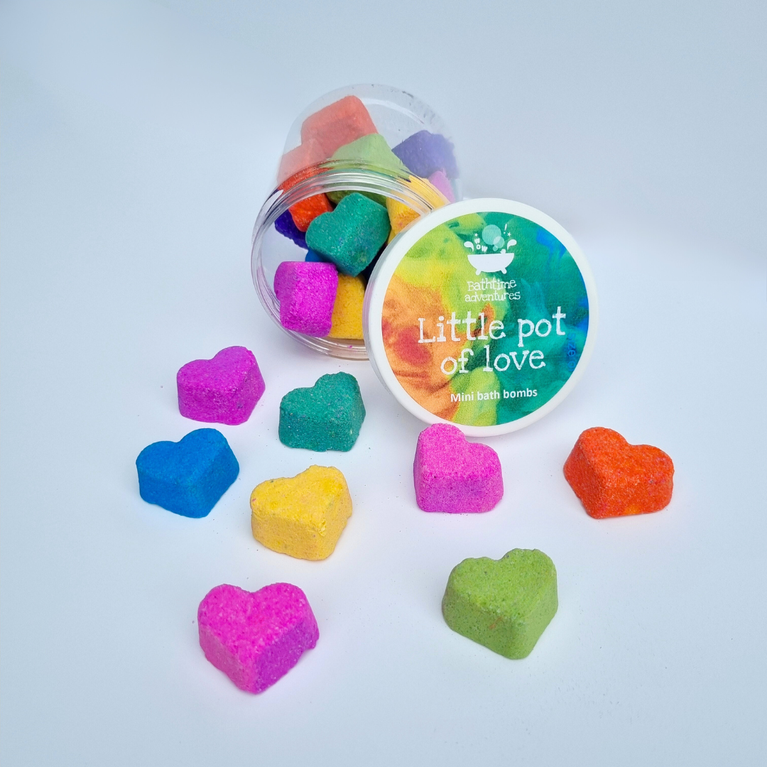 Pot of colourful mini heart-shaped bath bombs with the label "little pot of love"