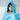 Child wearing a turquoise hooded towel with personalised Royal Guards trim