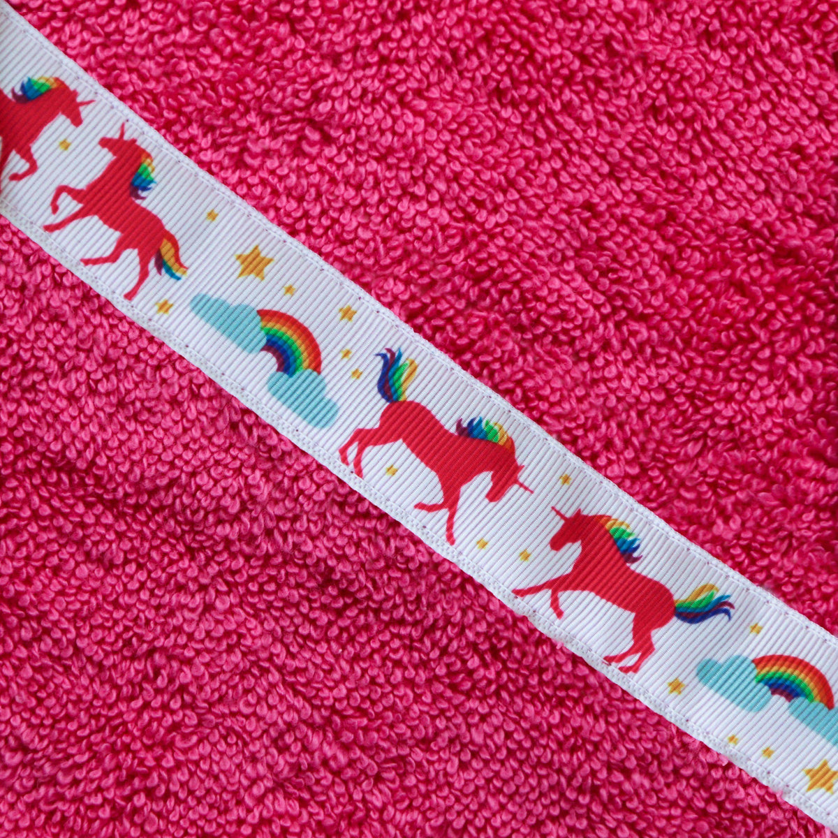 Children's pink hooded towel with Unicorns trim