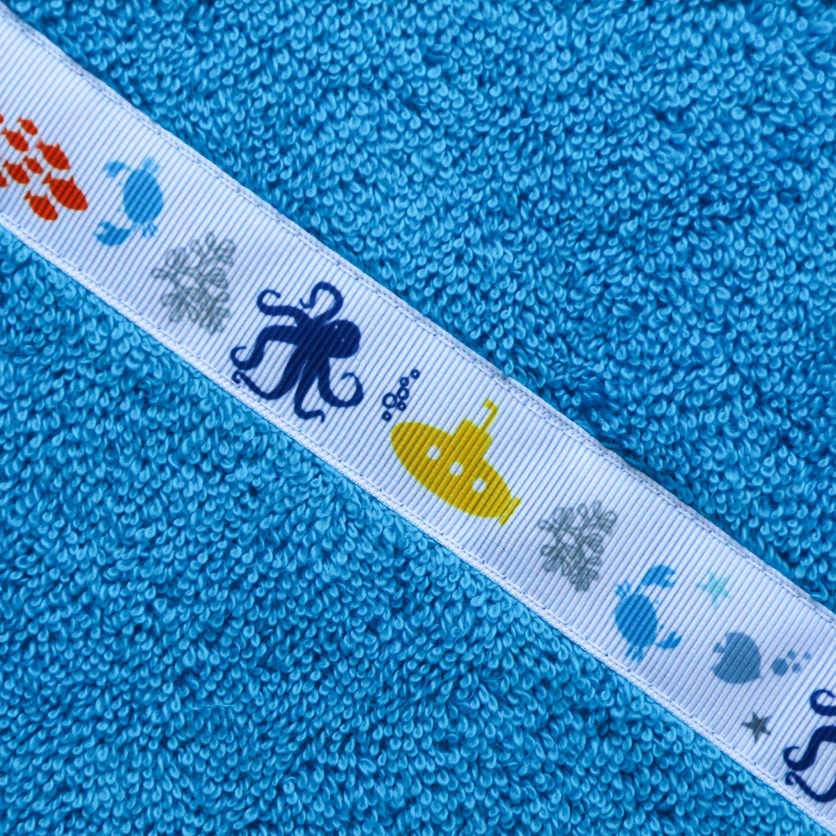 Children's turquoise hooded towel with Yellow Submarine trim