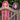 Two little girls, one wearing a pink hooded towel and one a purple hooded towel peeking over a garden gate 