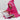 Girl sat reading a book wearing a pink hooded towel with navy pink stars trim